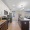 a kitchen with brown cabinets and wood floors