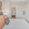 a bed with a white wall