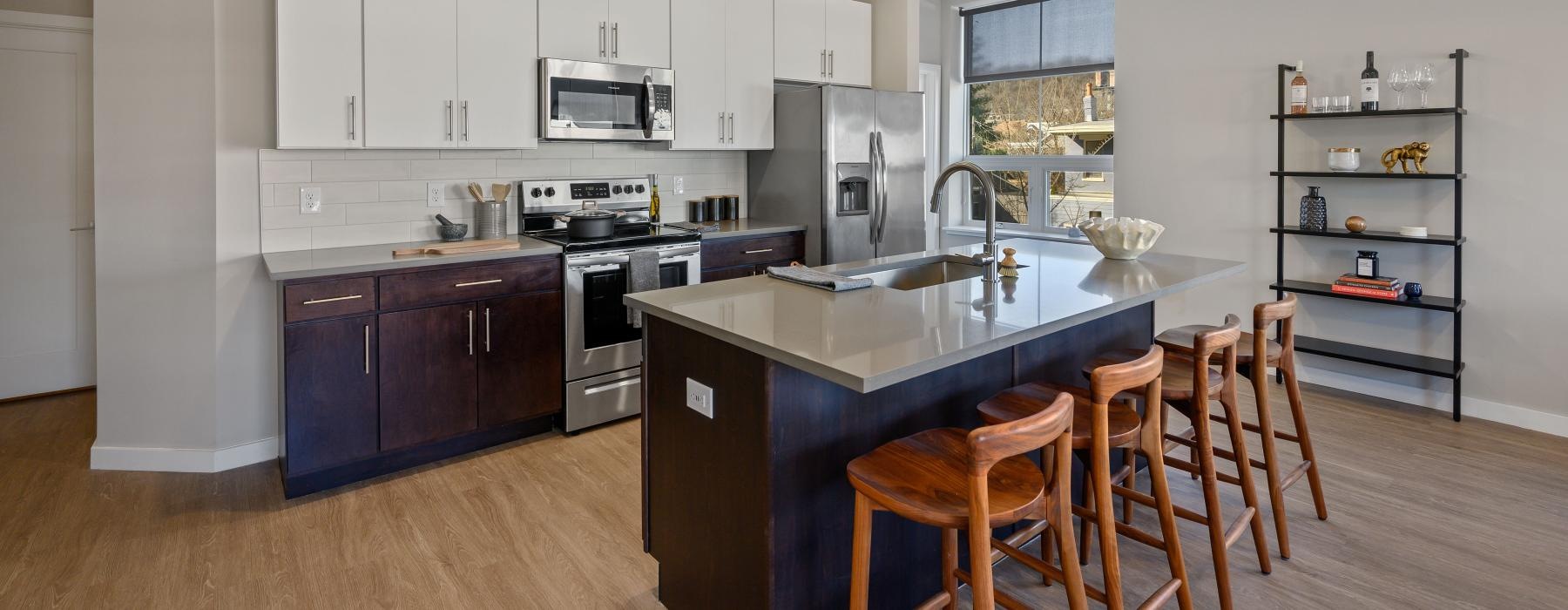 a kitchen with a bar island