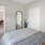a bedroom with a bed and a table