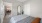 a bedroom with a bed and a table