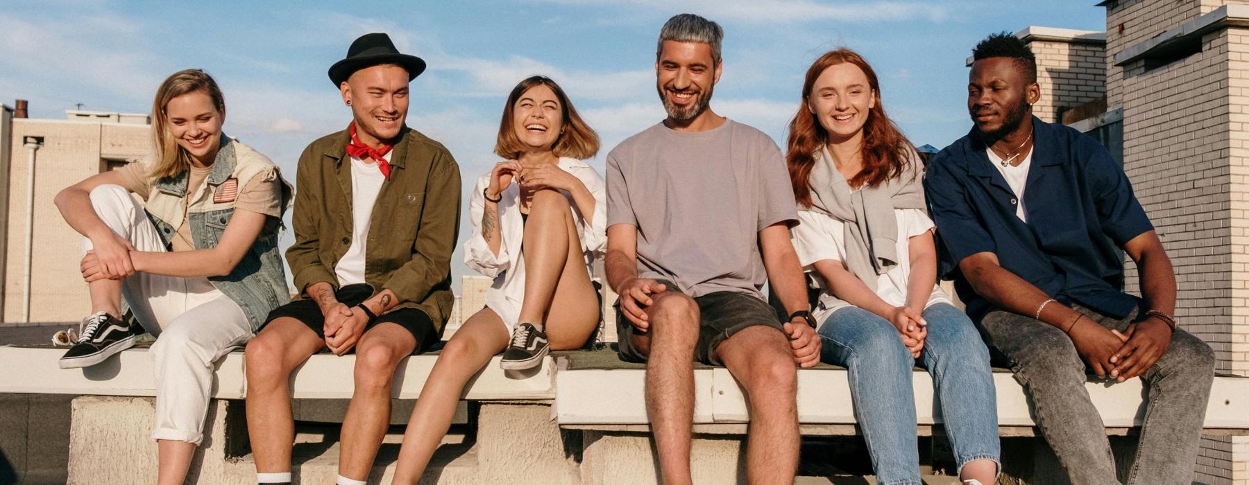 a group of people sitting on a bench