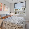 a bedroom with a large window