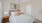 a bedroom with a bed and a lamp