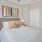 a bedroom with a bed and a lamp