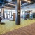a large gym with a large floor and lots of equipment