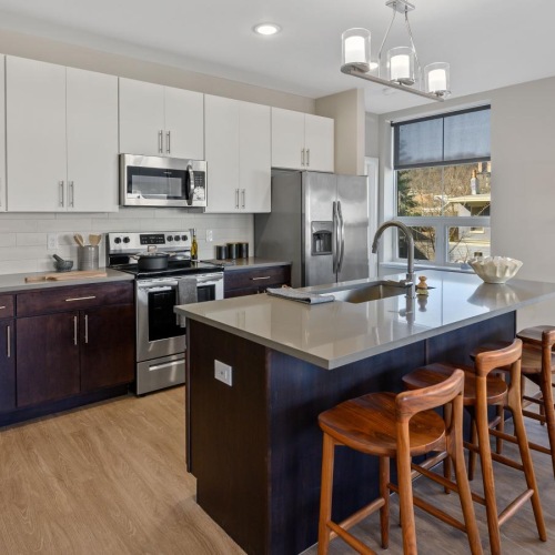 a kitchen with a bar island